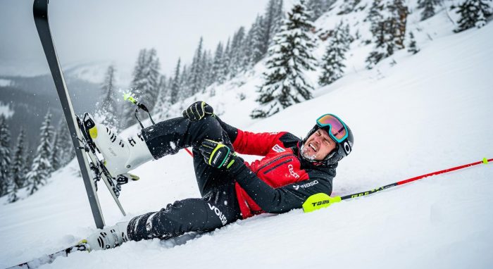 Man who has fallen over whilst skiing